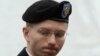 FILE - U.S. Army Private First Class Bradley Manning enters the courtroom for day four of his court martial at Fort Meade, Maryland, June 10, 2013. 