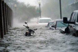 Floodwaters move on the street, Sept. 16, 2020, in Pensacola, Fla. Hurricane Sally made landfall Wednesday near Gulf Shores, Alabama, as a Category 2 storm.