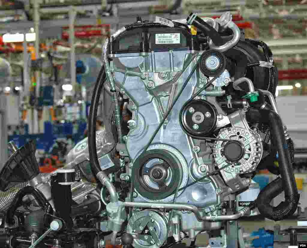 Some automakers manufacture their own engines in Thailand. Others import them. This Ford engine is made in India. (Steve L. Herman/VOA)