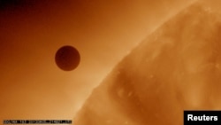 This handout image, courtesy of NASA, shows the planet Venus at the start of its transit of the Sun, June 5, 2012. (REUTERS/NASA/AIA/Solar Dynamics Observatory/Handout)