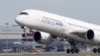 FILE - An Airbus A350 takes off at the aircraft builder's headquarters in Colomiers near Toulouse, France, Sept. 27, 2019.