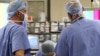 Jazmine Raygoza is prepared for Lap-Band surgery by anesthesiologist Dr. Andrea Grilli (C) Surgical First Assistant Tony Covello (R) and Dr. Michael Snyder (L) at Rose Medical Center in Denver June 20, 2011 . After trying multiple diets and exercise, Jazm