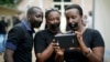 Journalists with tape on their mouths gather on the occasion of World Press Freedom Day, Bujumbura, Burundi, May 3, 2015. 