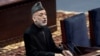 FILE - Afghan President Hamid Karzai speaks during the first day of the Loya Jirga in Kabul, Afghanistan, Nov. 21, 2013.