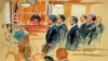 This courtroom sketch depicts Paul Manafort, fourth from right, standing with his lawyers in front of U.S. district Judge T.S. Ellis III, center rear, and the selected jury, seated left, during the jury selection of his trial at the Alexandria Federal Courthouse in Alexandria, Virginia, July 31, 2018.