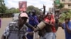 Youth took to the streets Monday demanding the resignation of Kenya's electoral commission officials, in Kisumu, Kenya, Oct. 16, 2017. Kenya’s opposition has vowed to continue with the protests until its demands are met. (M. Yusuf/VOA) 