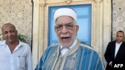 FILE - First Vice President of the Assembly Abdel Fattah Mourou (C) arrives to attend the swearing-in ceremony of Tunisia's parliamentary speaker Mohamed Ennaceur as interim president, July 25, 2019. 