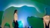Thailand's Prime Minister Yingluck Shinawatra is seen walking on stage before opening the CITES meeting in Bangkok March 3, 2013.