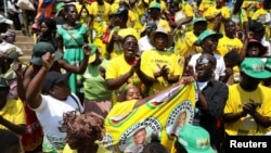 Mourners sing at Rufaro stadium, in Mbare township where the body of Zimbabwe's founder Robert Mugabe will lie in state, Harare, Zimbabwe, Sept. 12, 2019.