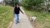 USA, Bethesda, Walking a dog in Battery lane