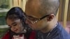 Christopher Astacio reads with his daughter Cristina, 2, who was recently diagnosed with a mild form of autism, New York, March 28, 2012.