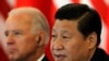 资料照：时任中国国家副主席习近平在北京接待到访的时任美国副总统拜登。(2011年8月19日)