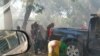 People react to tear gas outside the Malawi Congress Party headquarters in Lilongwe, Malawi, June 6, 2019, in this still image obtained from video taken from social media. 