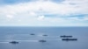 美国海军的尼米兹号和里根号航空母舰组成的双航母战斗群7月6日在南中国海航行。（美国海军提供）