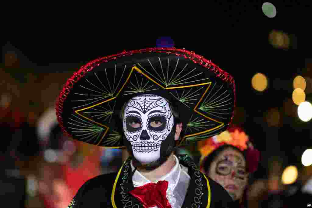 A Halloween reveler dressed in costume participates in New York City's 48th annual Greenwich Village Halloween Parade, Oct. 31, 2021.