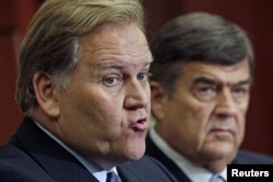 House Intelligence Committee Chairman Mike Rogers (R-MI) (L) and Rep. Dutch Ruppersberger (D-MD) hold a news conference to release a report on "national security threats posed by Chinese telecommunications companies Huawei and ZTE" on Capitol Hill in Washington, October 8, 2012.