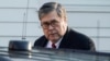 FILE - Attorney General William Barr leaves his house in McClean, Virginia, March 25, 2019.