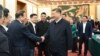 2025年2月17日，中國國家主席習近平在北京出席民營企業座談會時與民營企業家代表握手。