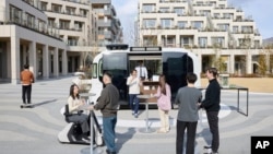 This photo provided by Woven by Toyota shows the square at the center of the apartment complexes of Woven City in Susono city, Shizuoka Prefecture on Feb. 2025. (Woven by Toyota via AP)
