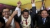 Meach Sovannara (C), a member of the Cambodia National Rescue Party (CNRP), cries next to CNRP President Sam Rainsy (L) and Deputy President Kem Sokha before a Buddhist ceremony at the CNRP office in Phnom Penh April 13, 2015. 