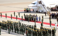 The body of former Zimbabwean President Robert Mugabe arrives back in the country after he died in Singapore after a long illness, Harare, Sept. 11, 2019.