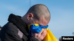 Ukrainian POW reacts after a swap at an unknown location in Ukraine