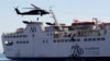 Members of the special forces rappel from a UH-60A Black Hawk helicopter as others use a rope ladder to board a ship during a boarding drill, part of the Eager Lion military exercise, in the coastal city of Aqaba, June 19, 2013.
