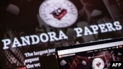 This photograph illustration shows the logo of Pandora Papers. (Photo by LOIC VENANCE / AFP)