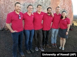 Scientists Joshua Ehrlich, from left, Laura Lark, Sam Payler, Brian Ramos, Jay Bevington and Ansley Barnard, pose for a photo before they enter a geodesic dome called Hawaii Space Exploration Analog and Simulation, or HI-SEAS located 8,200 feet above sea level on Mauna Loa on the island of Hawaii, Jan. 19, 2017