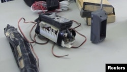 An Improvised Explosive Device (IED) used by the Taliban is displayed during a lesson on identifying IEDs for Afghan policemen conducted by U.S. army soldiers at Camp Nathan Smith in Kandahar, southern Afghanistan, October 15, 2012. 