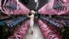 Employee works inside silk factory in Neijiang, Sichuan province, July 3, 2013. 