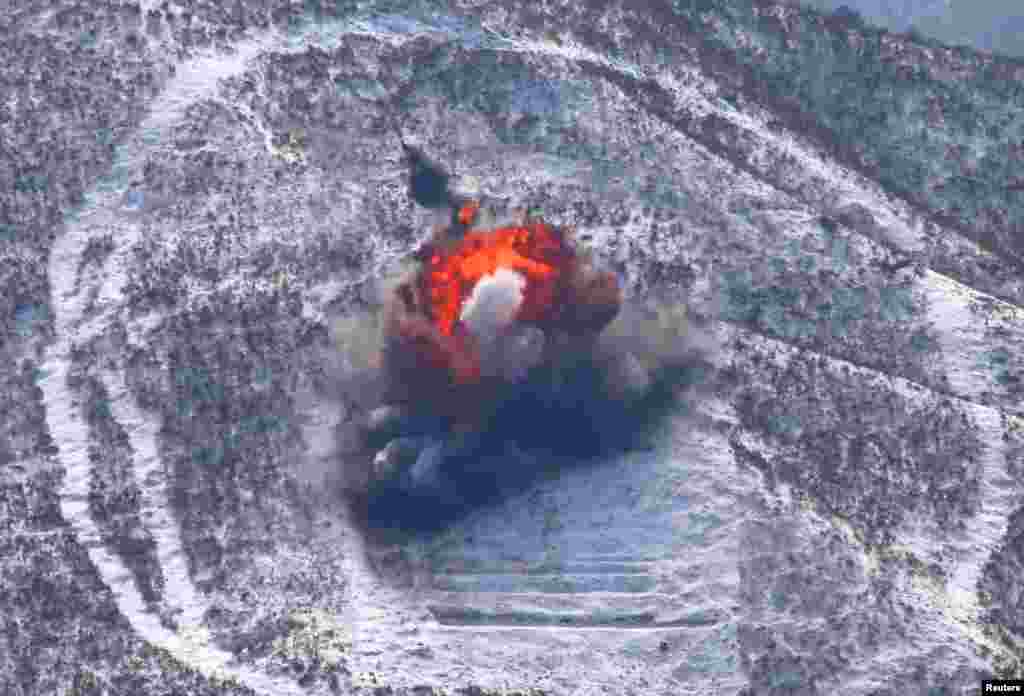 The air force and air defense artillery units of of the Korean People's Army conducts a drill of drone planes assaulting targets in a picture released by the North's official KCNA news agency, March 20, 2013. 