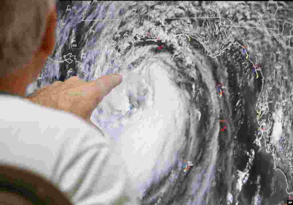 Senior hurricane specialist Stacy Stewart tracks Isaac at the National Hurricane Center in Miami, Aug. 28, 2012.