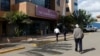 Patients walk into the Nairobi Hospital during a strike by government doctors to demand the fulfilment of a 2013 agreement between their union and the government that would raise their pay and improve working conditions, Feb. 15, 2017. 