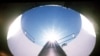 An Air Force An LGM-118A Peacekeeper intercontinental ballistic missile points skyward from its position in a silo