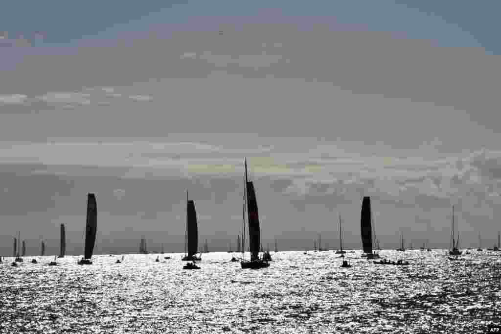 Imoca monohulls sail off the coast to take the start of the Vendee Globe solo around-the-world sailing race in Les Sables-d'Olonne, western France.