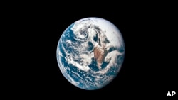 This May 18, 1969 photo made available by NASA shows Earth from 66,672 kilometers away as photographed from the Apollo 10 spacecraft. (NASA via AP)

