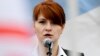 FILE - Maria Butina speaks at a rally in support of legalizing the possession of handguns, in Moscow, Russia, April 21, 2013. 
