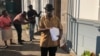 Jameson Timba, the chief election of Movement for Democratic Change Alliance, arrives at the Constitutional Court to file court papers in a bid to reverse President Emmerson Mnangagwa’s July polls official victory, Aug. 10, 2018. (C. Mavhunga/ VOA)