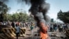 Opposition supporters block streets and burn tires during a protest in Kisumu, Kenya, on Oct. 11, 2017. Supporters of Kenya's opposition leader Raila Odinga took to the streets as poll officials mull their next move after his withdrawal from an upcoming presidential election.