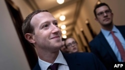 In this file photo taken on September 19, 2019, Facebook CEO Mark Zuckerberg walks to meetings for technology regulations and social media issues on Capitol Hill, in Washington, DC. 