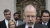 In this April 25, 2006, file photo, John Durham speaks to reporters on the steps of U.S. District Court in New Haven, Conn. 