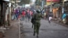 FILE - Opposition supporters run away from police during clashes after the election commission announced results from the Oct. 26 vote in the Kibera area of Nairobi, Kenya, Oct. 30, 2017. 