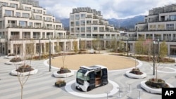 This photo provided by Woven by Toyota shows the square at the center of the apartment complexes of Woven City in Susono city, Shizuoka Prefecture on Feb. 2025. (Woven by Toyota via AP)