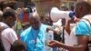FILE - UNICEF health workers teach people about the Ebola virus and how to prevent infection, in Conakry, Guinea, March 31, 2014..