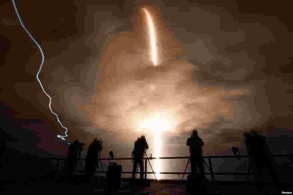 A long exposure shows a SpaceX Falcon 9 rocket, with the Crew Dragon capsule, as it is launched carrying three NASA and one ESA astronauts on a mission to the International Space Station at the Kennedy Space Center in Cape Canaveral, Florida, Nov. 10, 2021.