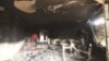 A man walks inside the U.S. consulate in Benghazi, which was attacked September 11 and set on fire by al-Qaida gunmen who killed Christopher Stevens, the U.S. ambassador to Libya, and three embassy staff, in Libya, September 12, 2012.