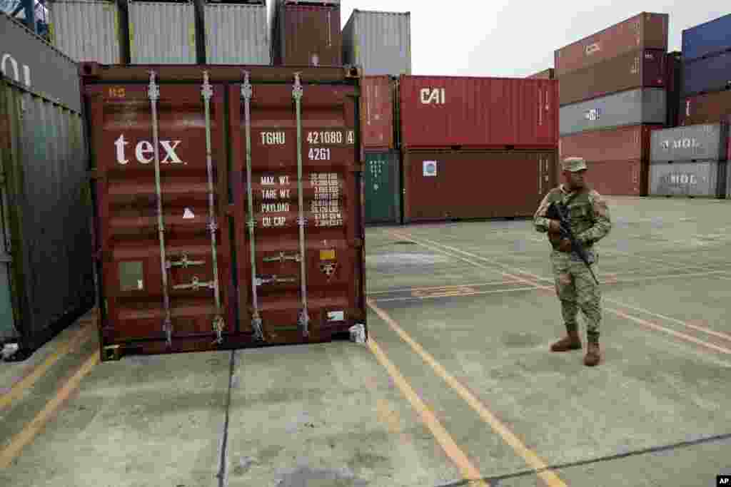 A police officer stands guard aboard the North Korean-flagged freighter, Chong Chon Gang, at the Manzanillo International container terminal on the coast of Colon City, Panama, July 17, 2013.