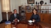Burmese opposition leader Aung San Suu Kyi, right, and United Nations Special Rapporteur for human rights in Burma Tomas Ojea Quintana pose for the media before their meeting at her residence, in Rangoon, February 16, 2013.