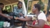 Flood survivors receive medication during mobile clinic hours in Machinga district.
